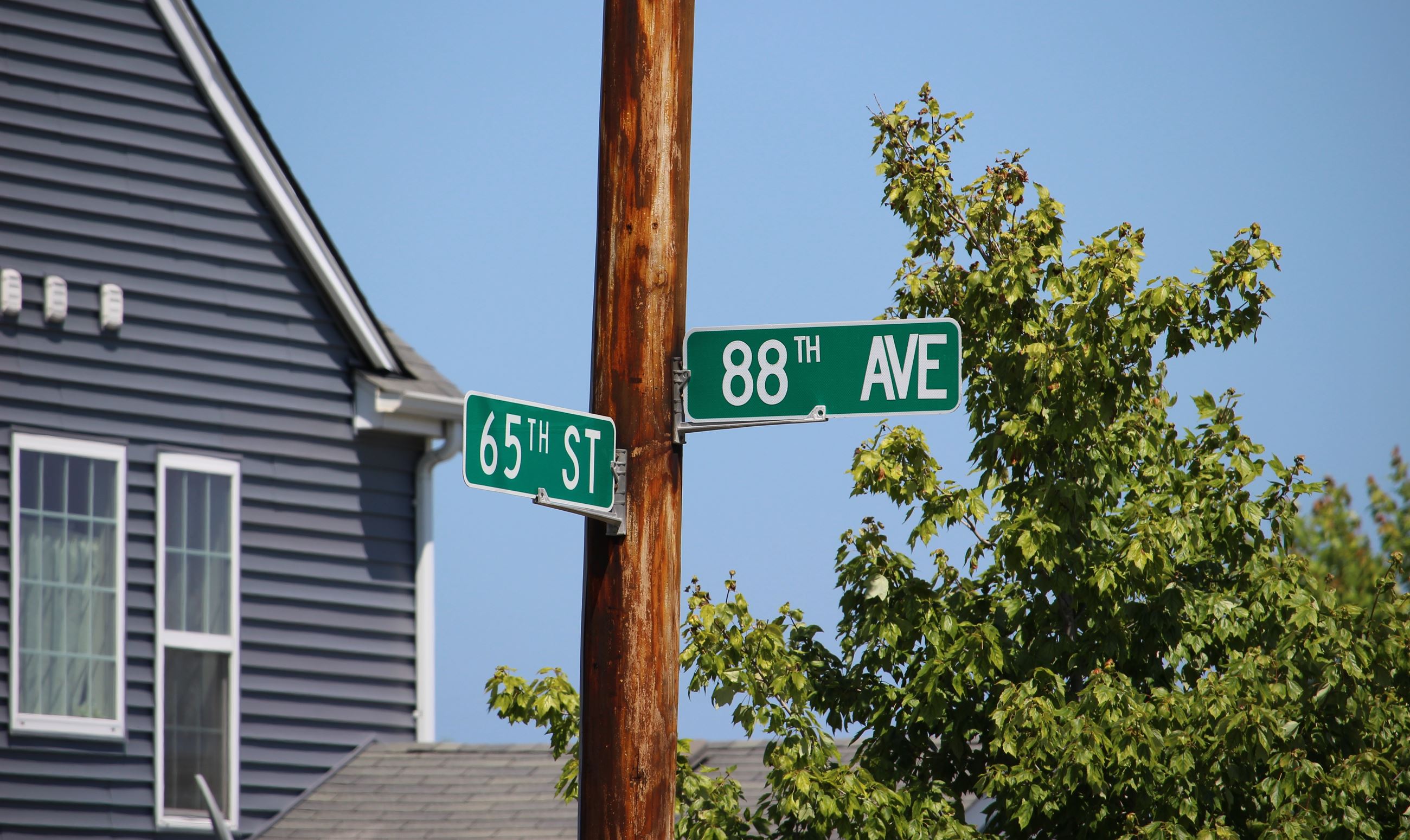 Highway H and 65th Street intersection street signs