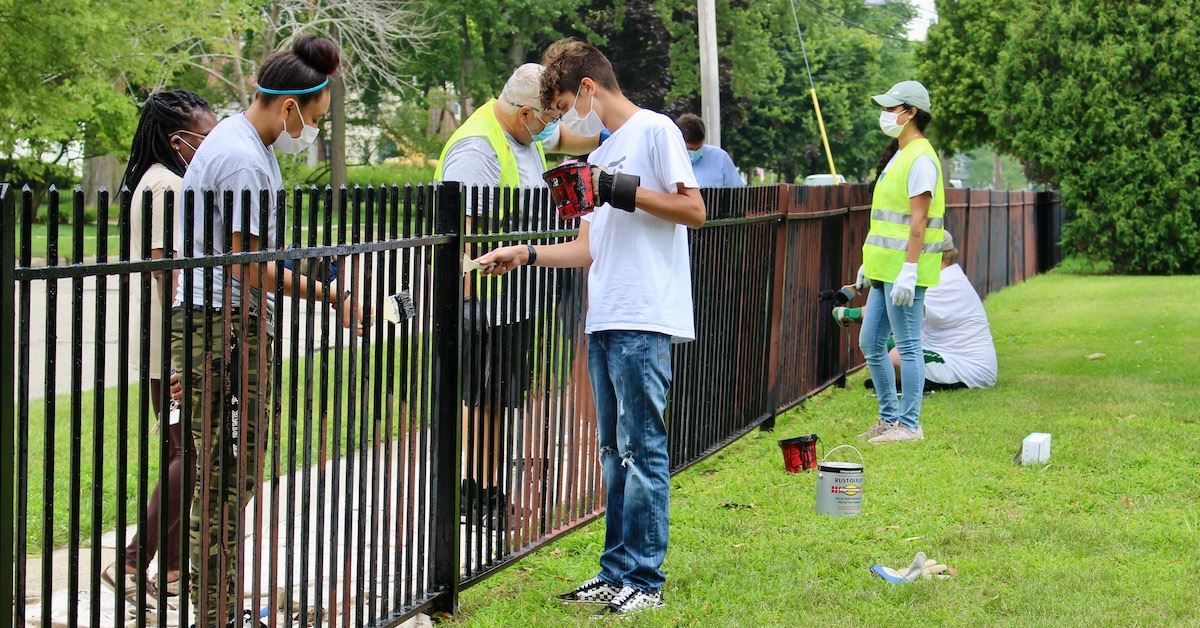 Fence painting during the 2020 Summer Youth Employment Program