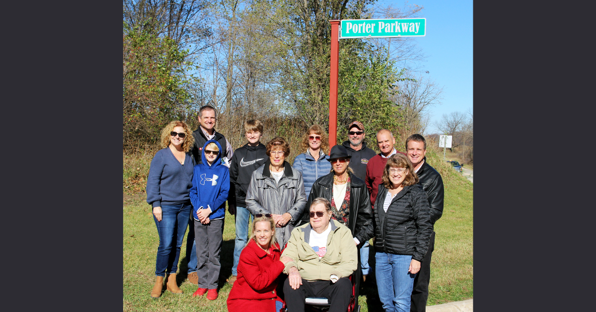 Group photo in front of Porter Parkway road sign