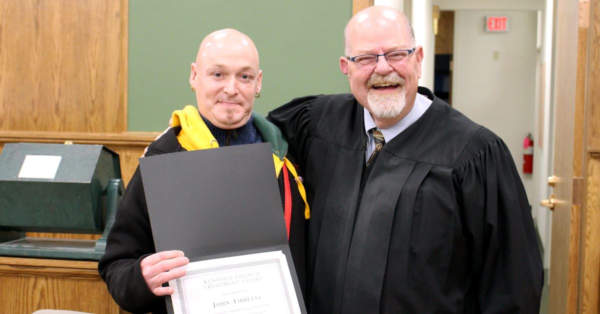 John Tibbetts poses for a photo with Judge David Wilk