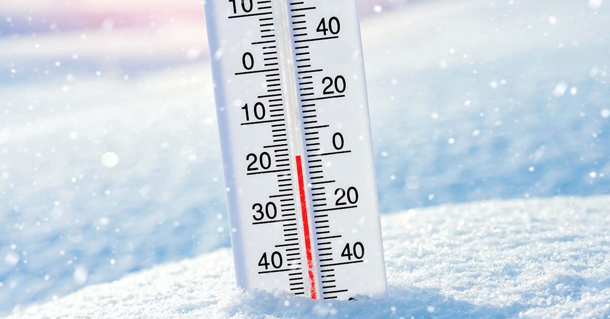 Photo of thermometer sticking out of the snow