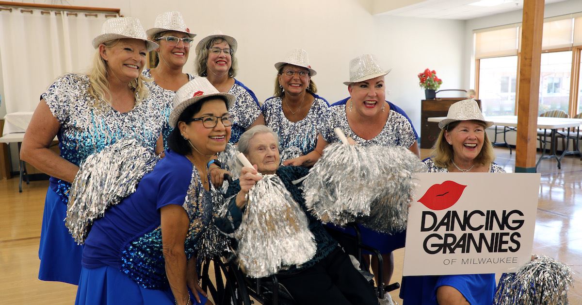 Photo of the Milwaukee Dancing Grannies posing with a Brookside resident