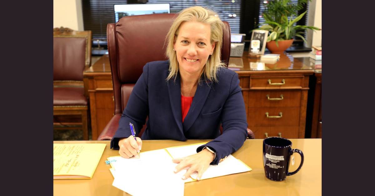Photo of County Executive Samantha Kerkman signing the 2024 budget