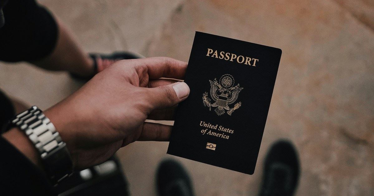 Photo of a passport in a person's hand